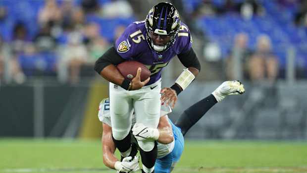 Titans linebacker Jack Gibbens (50) tackles Baltimore Ravens quarterback Brett Hundley (15) during the third quarter of a preseason game.